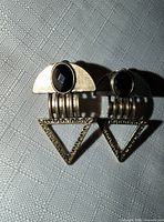 Front view of both earrings showing overall design and materials