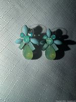 Front view of both earrings showing stone arrangement and colours