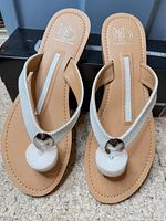 Full view of both sandals showing design, uppers, footbeds and box