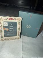 Front view of porcelain frame next to original Lenox box