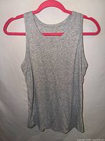 Front view of gray ribbed Danskin tank top on hanger