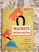 front cover showing title, authors, illustration, handwriting