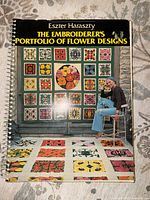 Front cover showing title, author, and collage of finished embroidery pieces