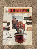 Front cover showing title, subtitle, author and train imagery