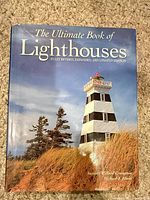 Front cover showing title, subtitle, authors, lighthouse photo