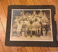 Front view of mounted photograph showing image and damaged mat