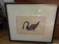 Full view of framed stencil print in black frame