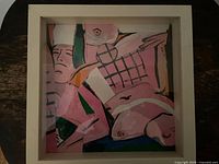 Front view of framed canvas collage artwork