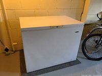 Front view of closed white Beaumark chest freezer