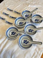 Set laid out: six bowls with spoons, six rests