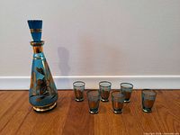 Full set showing decanter with stopper and six glasses