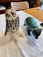 Owl and bear figurines side by side full view