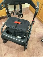 Front view showing seat cushion, basket and wheels