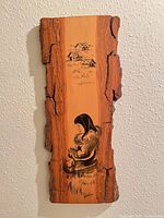 Front view of entire plaque showing painted scene and bark edges