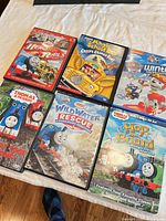 All six DVD cases front covers visible