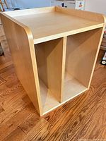 front angled view showing overall shape, finish and two open compartments