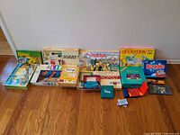 All boxed board games and card decks lined along wall