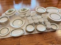 Full layout of dinnerware set on floor