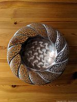 Top view of silver-plated bowl showing pierced filigree rim and hammered interior