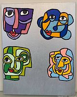 Full view of abstract painting showing four cubist faces