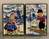 Both framed cross stitch pieces side by side