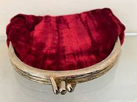 Top view displaying silver-tone metal frame and kiss lock clasp