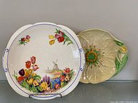 Both ceramic plates on display shelf