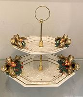 Front view showing both octagonal tiers, handle and decorative bows