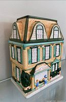Front angled view of ceramic Sweet Shop house cookie jar