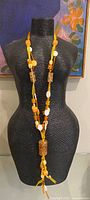 Full view of necklace on mannequin showing length and bead arrangement