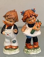 Front view of both figurines together