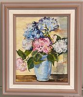 Full view of framed oil painting showing floral still life