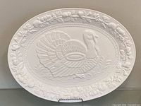 Front view of entire white oval turkey platter