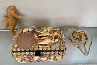 Group view showing jewelry box, glass heart and wooden seahorse