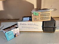 Three boxes containing mixed bulbs, hardware and tool case