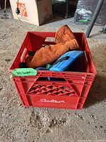 crate containing gloves and mitts
