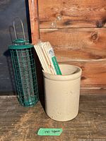 Overall view of bird feeder, shim pack and crock together