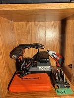 Group shot of drill, charger, screwdriver, bit set, and case