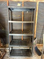 Full frontal view of entire shelving unit with five tiers