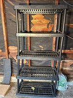 Front view of entire shelving unit showing five shelves