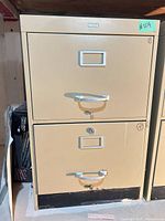 Front view of beige 2-drawer Cole file cabinet with chrome handles and lock