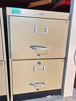 Front view of beige 2-drawer Cole lateral file cabinet with chrome handles and label frames