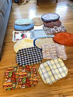 Group shot of all eleven assorted placemats laid out on floor