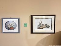 Both framed prints on wall showing size and frames