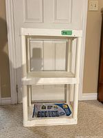Front view of white three-tier Plano shelf