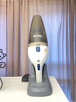 Front view of ReadiVac Storm handheld vacuum seated in charging dock