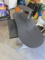 Full view of desk showing keyboard tray and riser