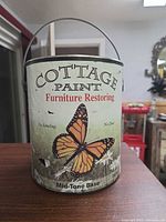 Front of paint can showing brand, product line, mid-tone base designation