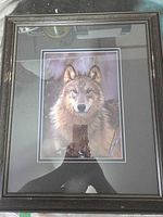 Front view showing wolf print, matting, and frame