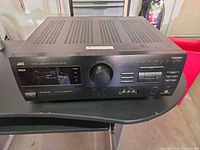 Front and top view of JVC RX-992V receiver showing display lit, controls, and overall condition